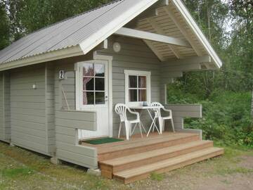 Фото номера Небольшой коттедж с видом на озеро Кемпинги Mansikkaharju Holiday Camp г. Леппявирта 4