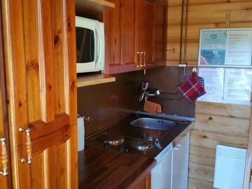 Фото номера Небольшой коттедж с видом на озеро Кемпинги Mansikkaharju Holiday Camp г. Леппявирта 9