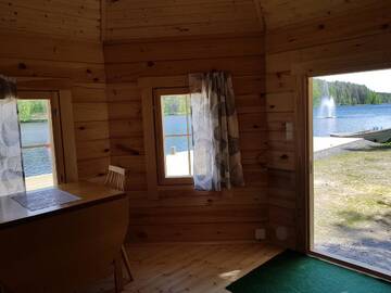 Фото номера Номер Kotamökki с видом на озеро Кемпинги Mansikkaharju Holiday Camp г. Леппявирта 3