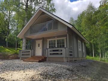 Фото номера Коттедж с 2 спальнями и собственной сауной Кемпинги Mansikkaharju Holiday Camp г. Леппявирта 2
