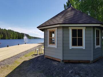 Фото номера Номер Kotamökki с видом на озеро Кемпинги Mansikkaharju Holiday Camp г. Леппявирта 2