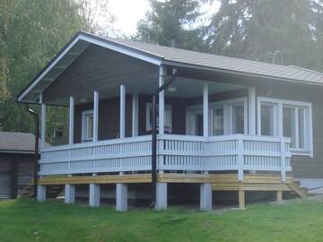 Фото номера Вилла с 1 спальней и сауной Кемпинги Mansikkaharju Holiday Camp г. Леппявирта 2