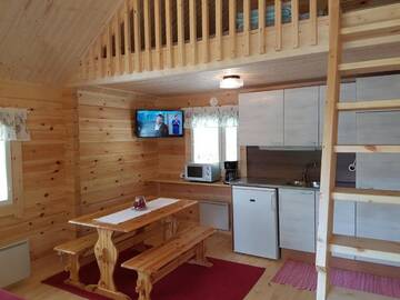 Фото номера Коттедж с видом на озеро Кемпинги Mansikkaharju Holiday Camp г. Леппявирта 4