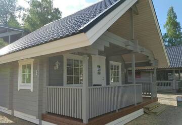 Фото номера Коттедж с видом на озеро Кемпинги Mansikkaharju Holiday Camp г. Леппявирта 3