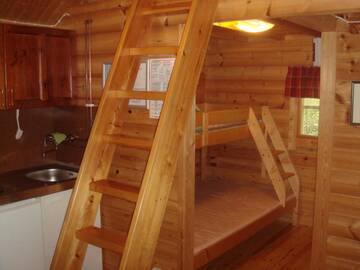 Фото номера Небольшой коттедж с видом на озеро Кемпинги Mansikkaharju Holiday Camp г. Леппявирта 13